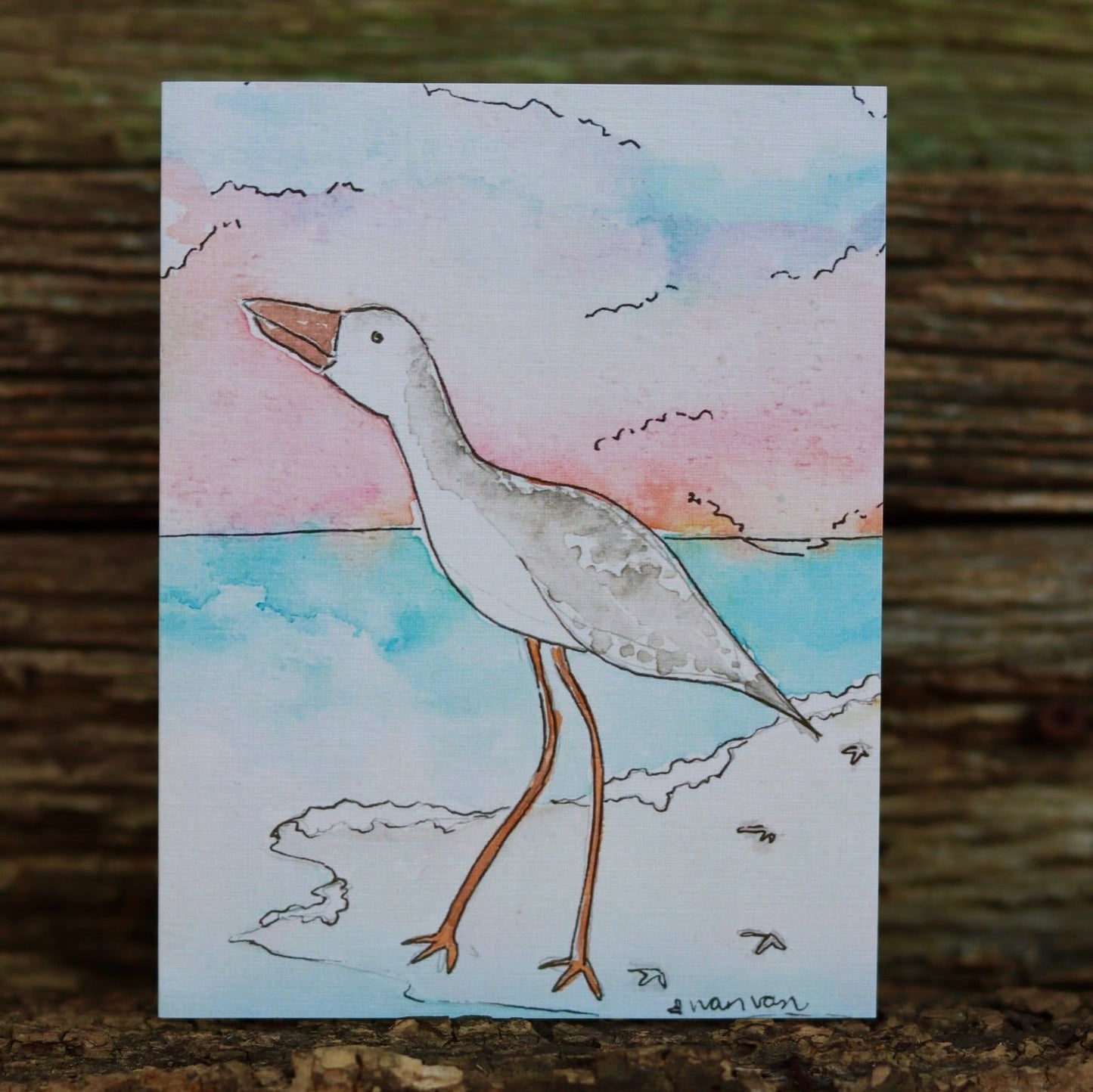 Seaside bird looking at the ocean from the beach card