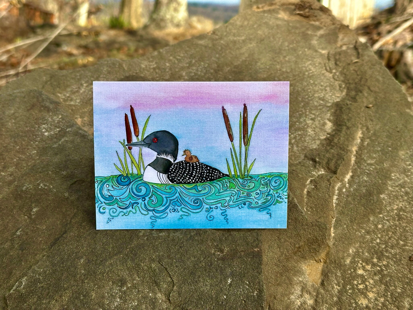 Mama Loon and Baby Loon Swimming Through Cattails (Card)
