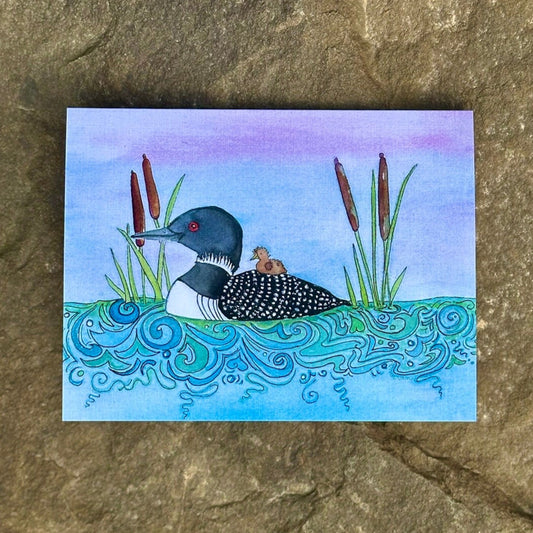 Mama and Baby Loon Swimming through Cattails Greeting Card