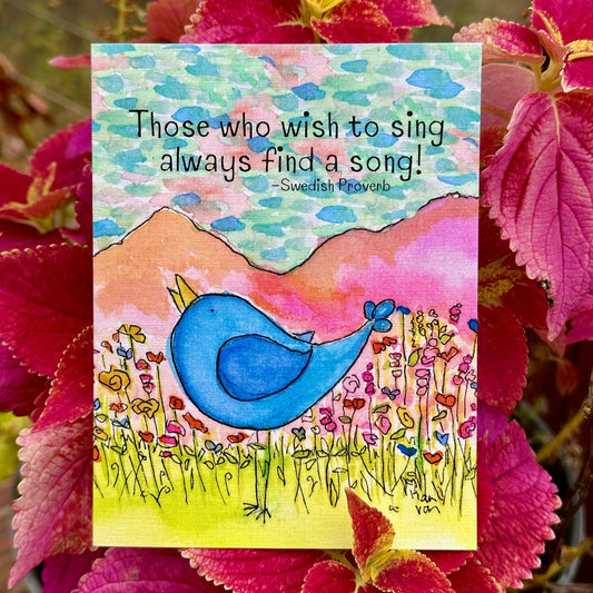 Those who wish to sing always find a song Blue Bird Standing in Wildflowers Mountain Backdrop Colorful Blue and Pink Sky Greeting Card